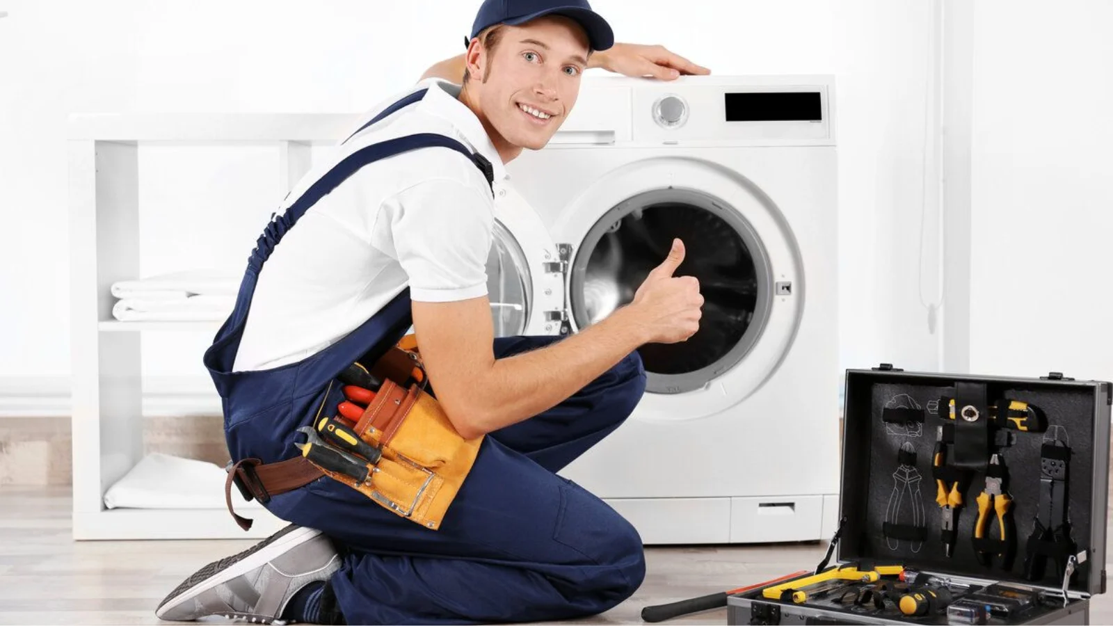 Technician performing same-day appliance repair in Tampa while fixing a built-in dishwasher in a modern kitchen.
